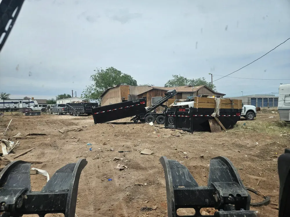 View from the hauling truck as a Big Fish Rentals container is set down on a job in Odessa, Texas.